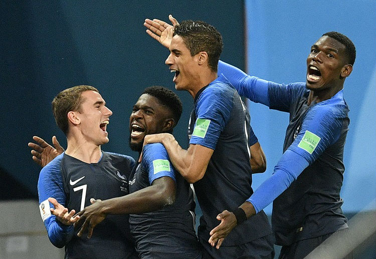 Samuel Umtiti celebrates with his team mates after scoring his side's first goal versus Belgium in World Cup 2018