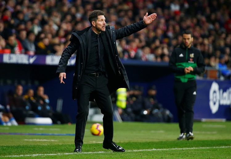 Diego Simeone's Atletico Madrid move level with Barcelona at the top of La Liga