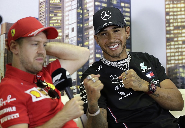 Lewis Hamilton and Sebastian Vettel pretends to box during the Formula 1 press conference